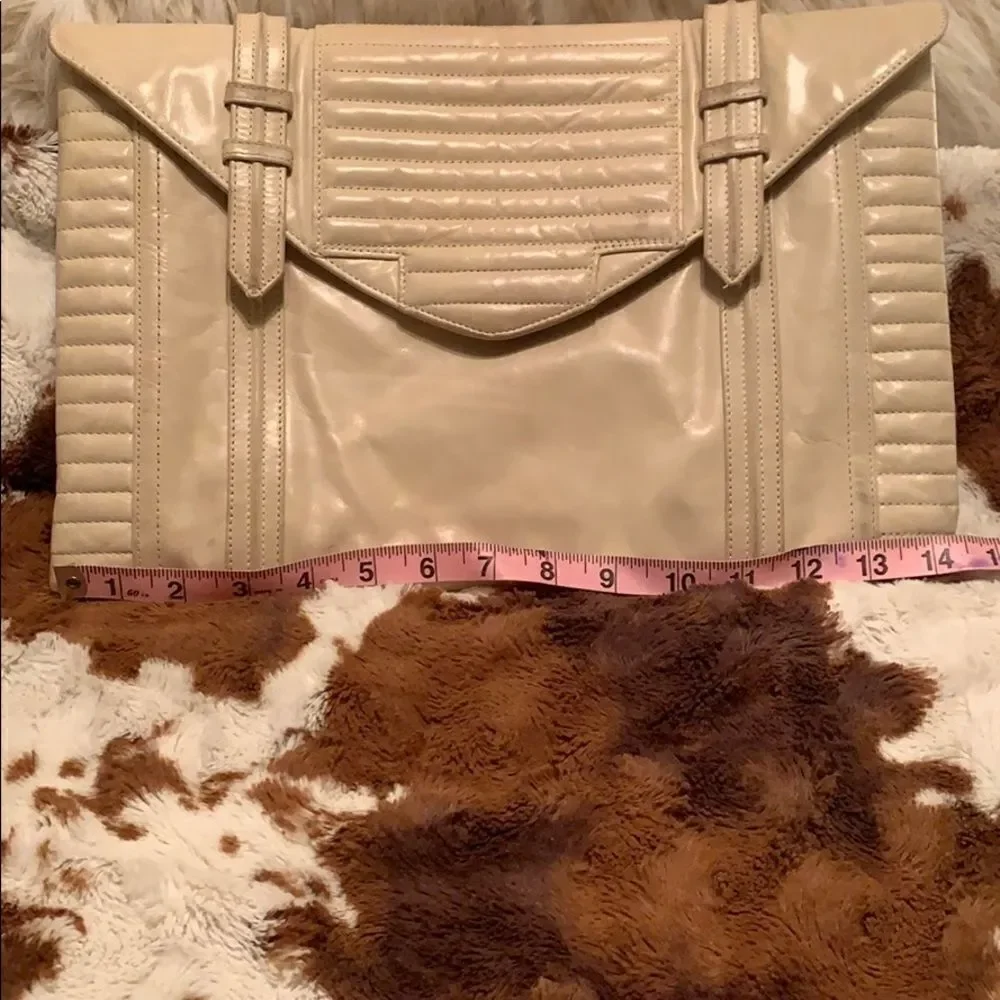 Reece Hudson cream colored clutch‎